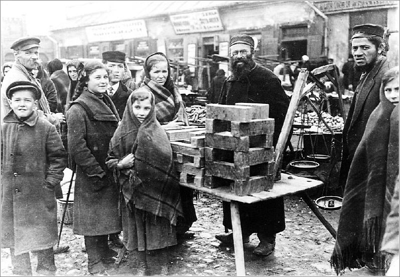A Jewish street vendor selling bars of soap in a Czestochowa marketplace.
